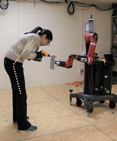 Worker interacting with robot