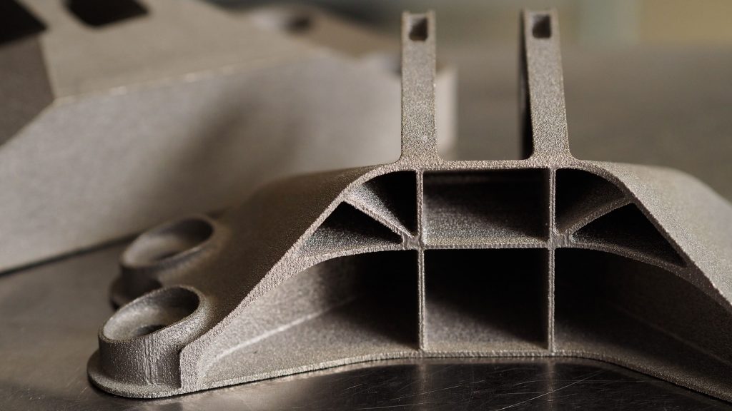 3D printing opens up room for design improvements, and that’s valuable when optimizing an aircraft’s size and speed. This 3D-printed clip (right), used to attach an engine to an airplane, is significantly lighter than its traditionally manufactured counterpart (left).