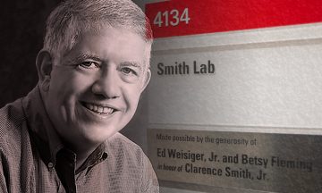 Clarence Smith and the Smith Lab sign