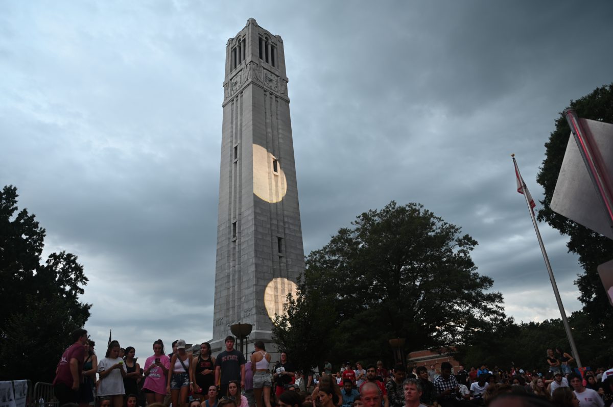 Students Waiting around the belltower for Abby to take the stage 