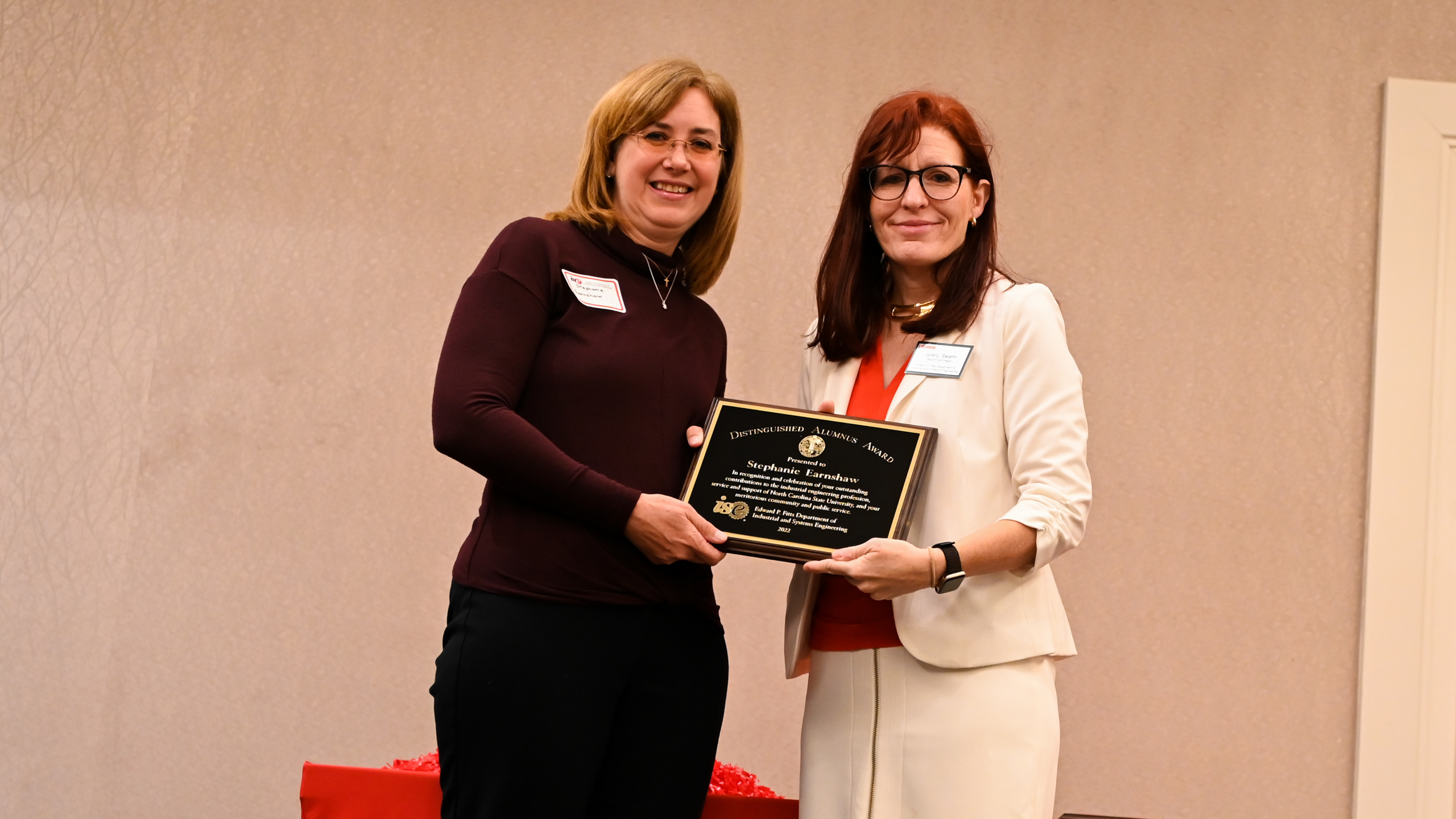 Distinguished Alumna Dr. Stephanie Earnshaw accepting her award from Dr. Julie Swann