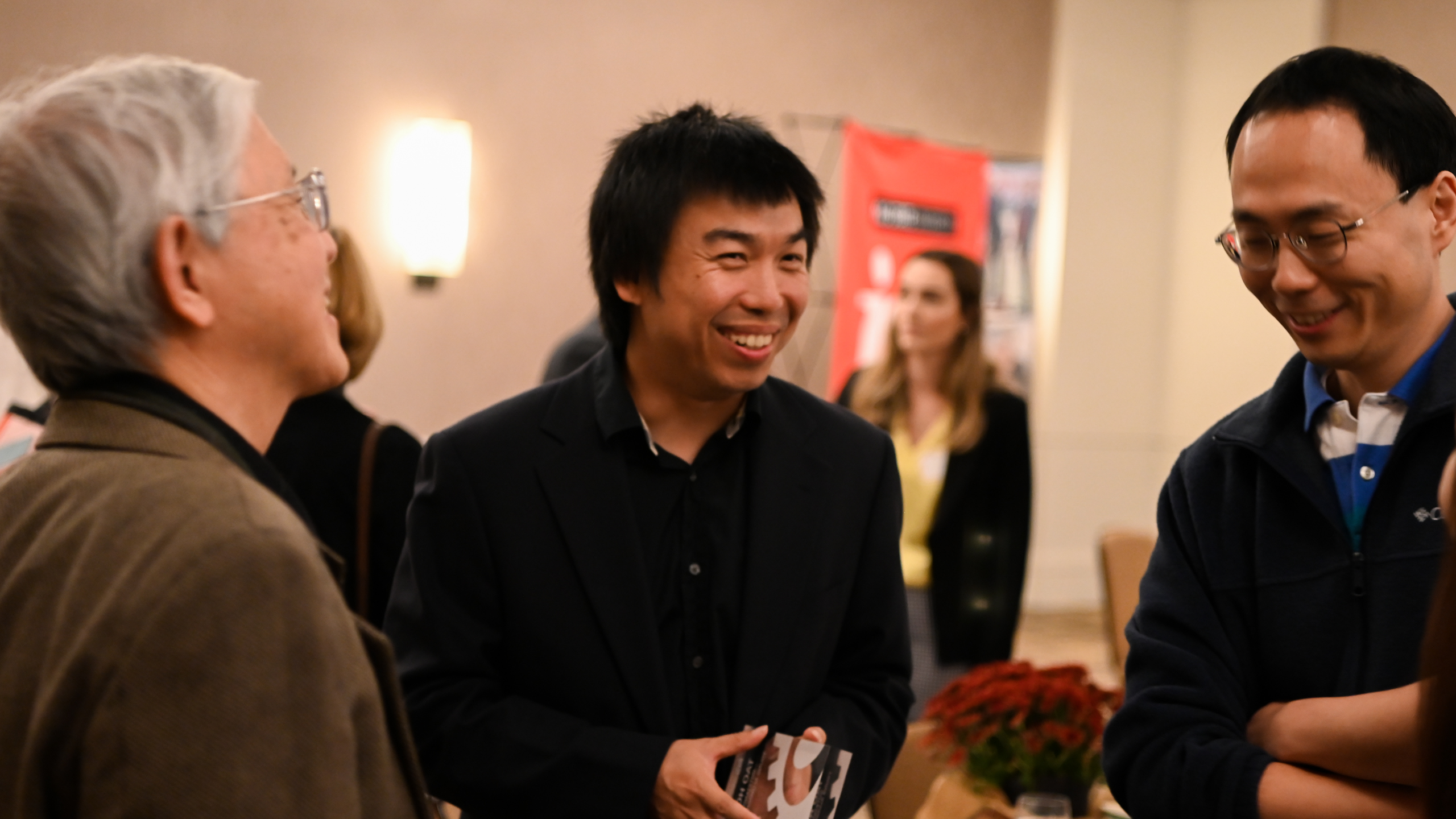Dr. Tao Hong chatting with ISE faculty members after the Hall of Fame Breakfast