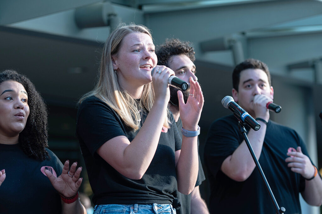 Rowan Bates sings a solo during Chordination A Cappella’s first on-campus performance on Aug. 26, 2021 during the All Music Showcase on Stafford Commons.