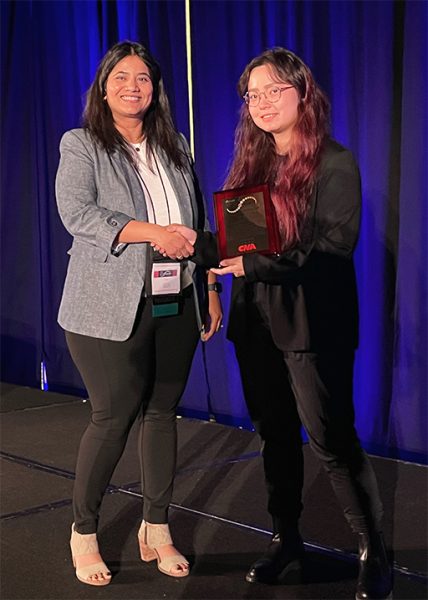 Emily Fang receives award at the Applied Ergonomics Conference