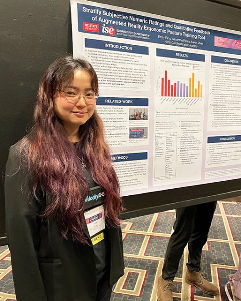 Emily Fang displays her poster at the Applied Ergonomics Conference