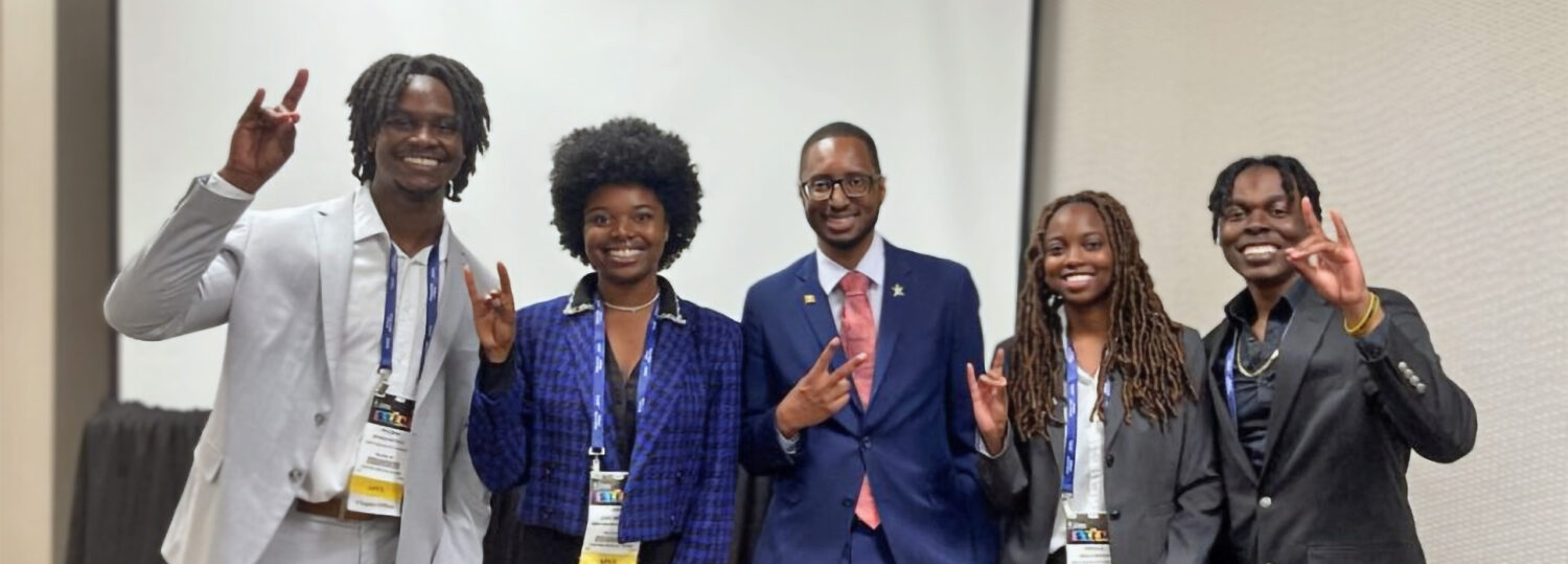 Five NC State NSBE members celebrating their contest win