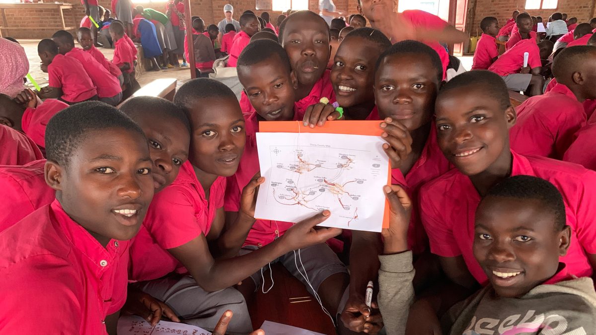 Here are some students from Karuganda primary school showing off their water network design from the water network activity.