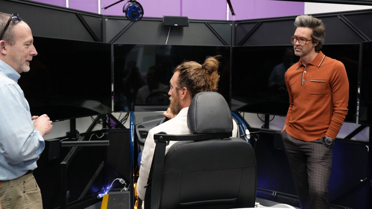 Rhett & Link testing out the 360 degree driving simulator