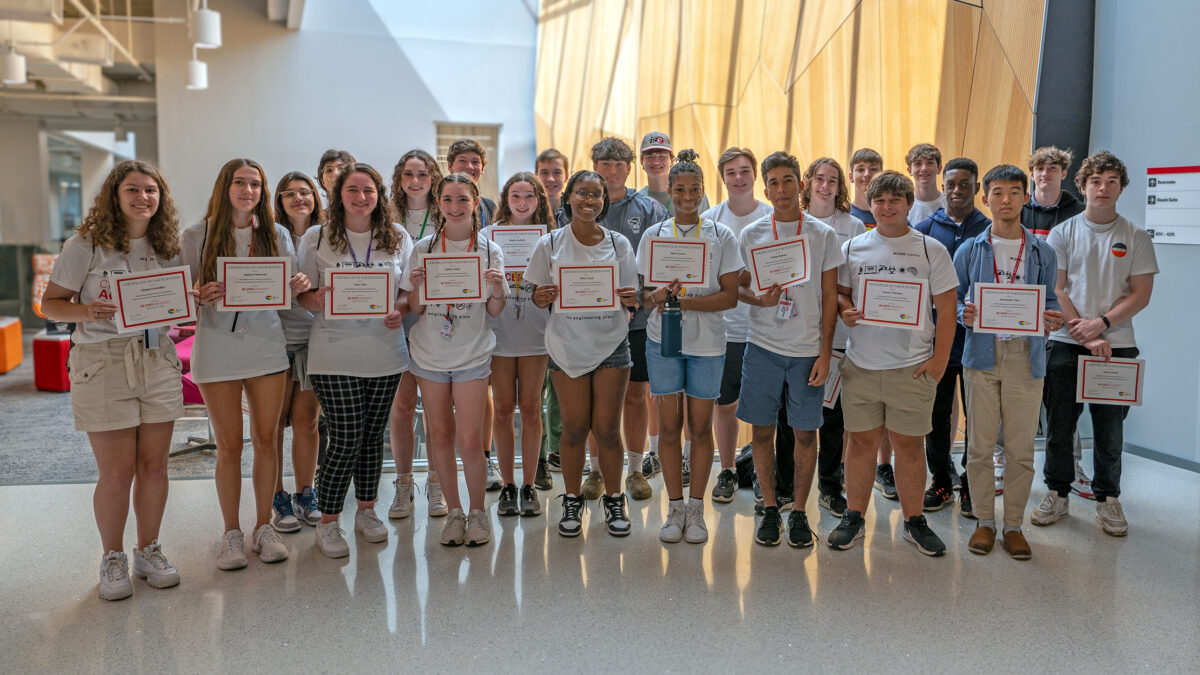 All of the summer campers showing off their certificates.