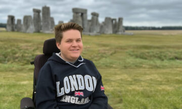 Jack Bolton sitting in front of Stonehenge