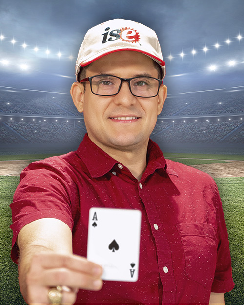 Adolfo Escobedo holding a ace card. in front of a stadium.