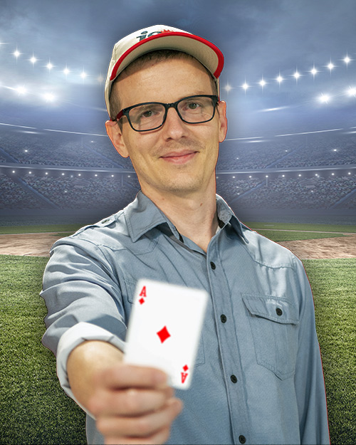 Jordan kern holding a ace card. in front of a stadium.