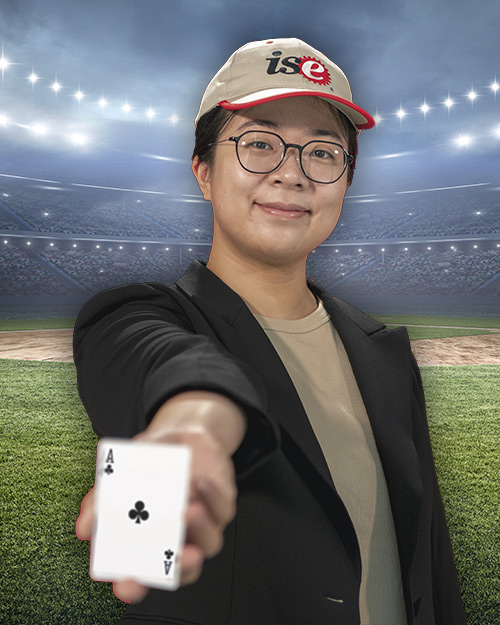 April Yu holding a ace card. in front of a stadium.