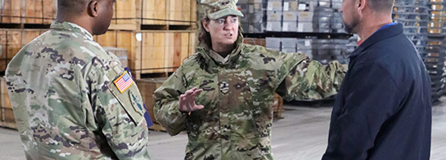 Maj. Gen. Michelle Rose discussing logistical issues with her fellow soldiers