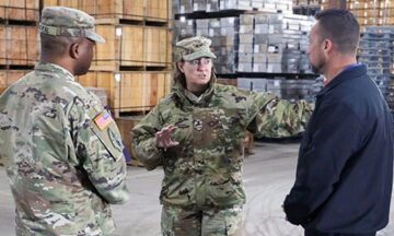 Maj. Gen. Michelle Rose discussing logistical issues with her fellow soldiers