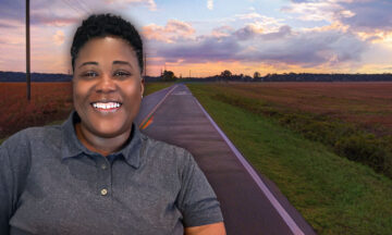 Tammy Montgomery standing in front of a rural highway in Bladen County, NC